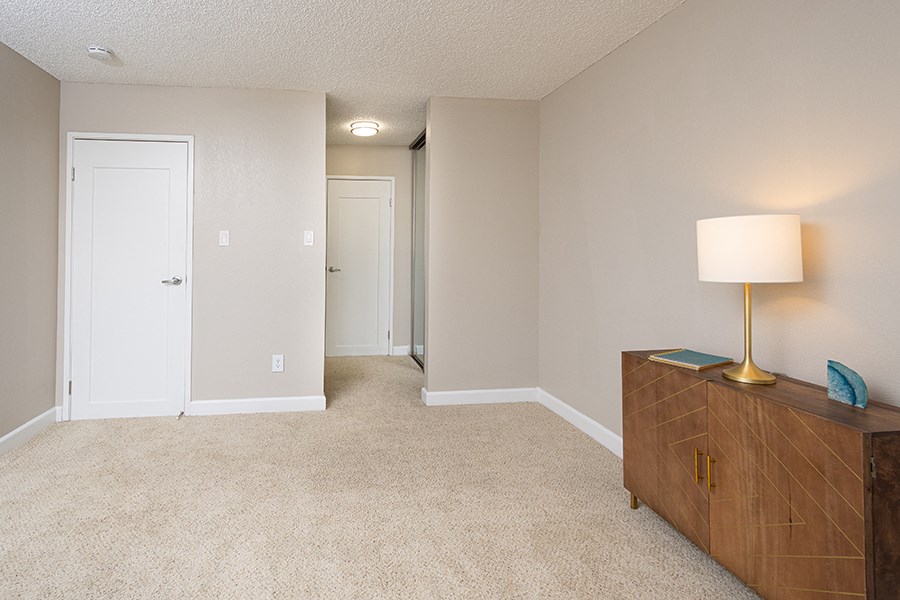 Two BR Apartments in Rohnert Park CA - The Lenox - Large Bedroom with Carpeted Floors, Dresser and Lamp