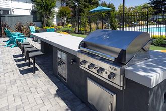 BBQ and seating near pool