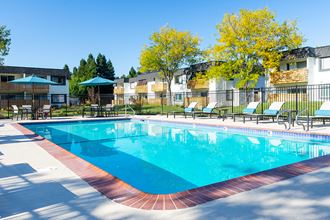 Rohnert Park Apartments - The Lenox - Gated Sparkling Pool with Lounge Seating, Tables and Umbrellas