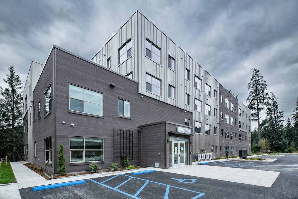 grey building near parking at TRILLIUM LANDING, JUNEAU, AK