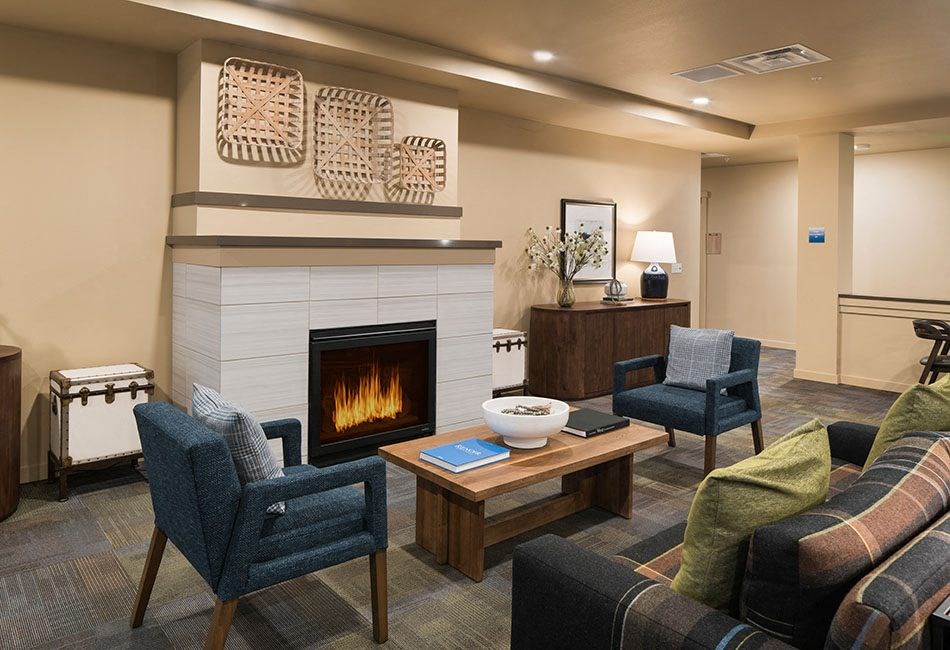 Seating by fireplace l Traditions at Federal Way in Washington 