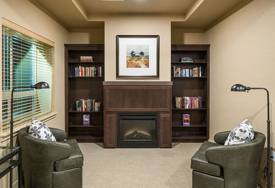 Seating by fireplace l Traditions at Federal Way in Washington 