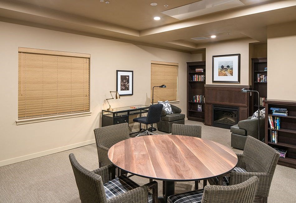 Seating by fireplace  l Traditions at Federal Way in Washington 