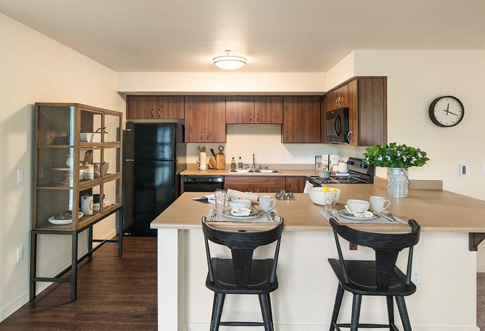 Kitchen with bar seating  l Traditions at Federal Way in Washington 