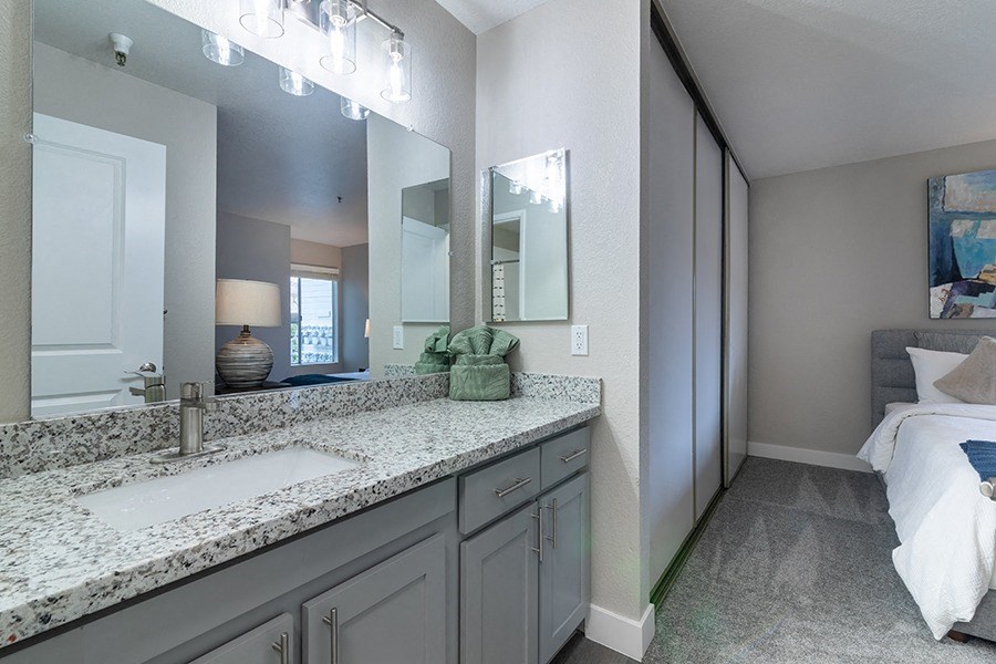 bathroom vanity with view to bedroom