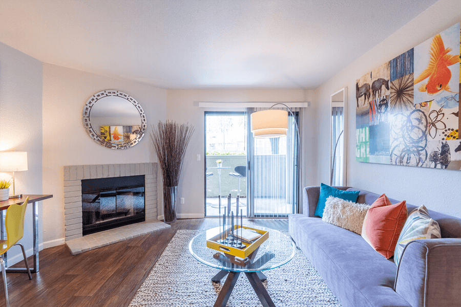 Living room with fireplace and patio door