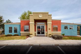 Exterior of leasing office with parking 