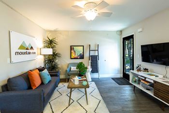 a living room with a couch and a coffee table at Mountain Run Apartments, Orem, Utah, 84058