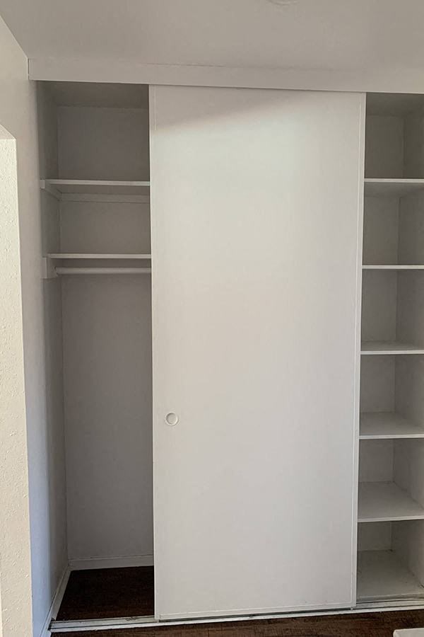 Hallway closet with shelves
