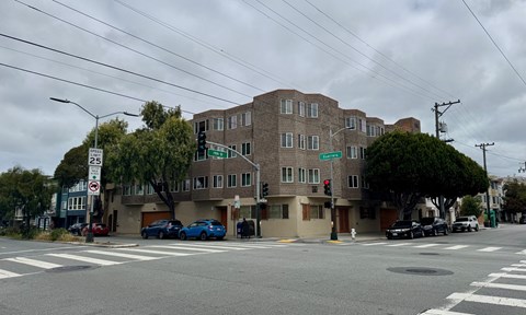 A street view of a building with a no parking sign.