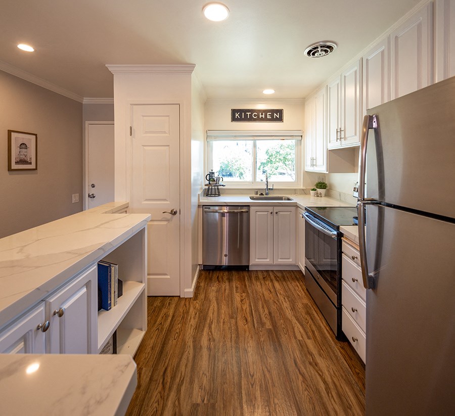 Walnut Creek, CA Apartments- Walnut Hill- Kitchen with Stainless-Steel Appliances, Spacious Quartz Countertops, and Wood-Style Floors
