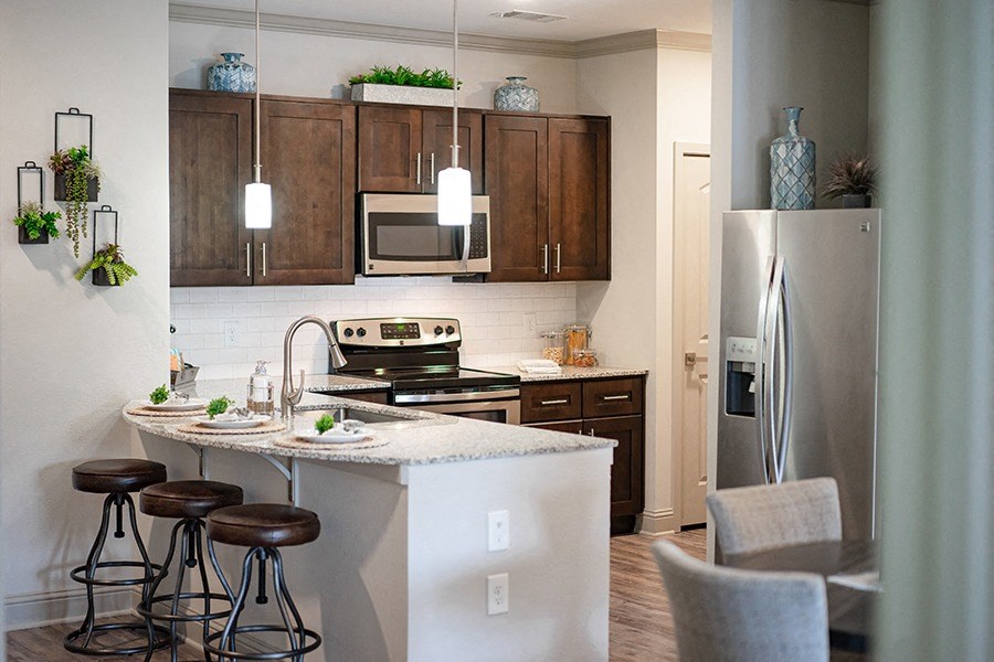 Full kitchen with stainless steel appliances and granite countertops