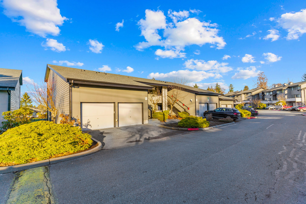 Beautiful lakefront property in Kent, WA with landscaped grounds