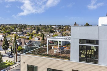 Exterior view of rooftop with seating - Photo Gallery 18
