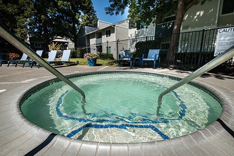 a hot tub in the middle of an apartment building