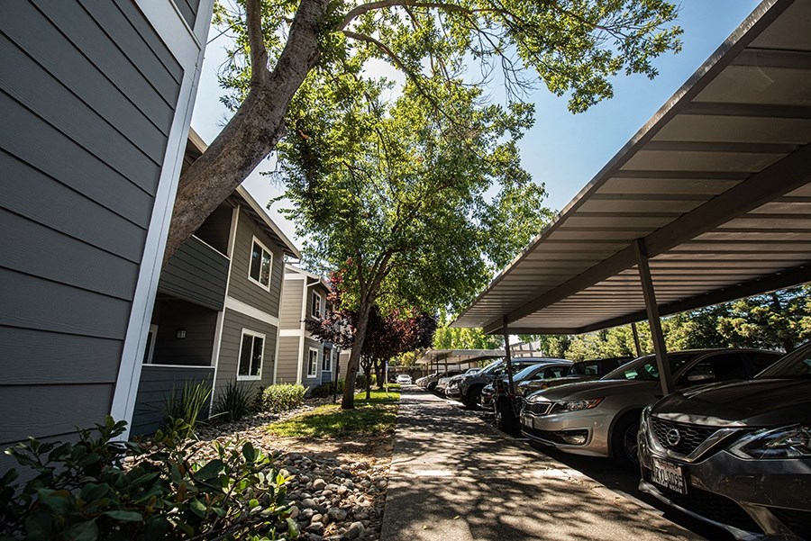 a row of cars parked in front of a house
