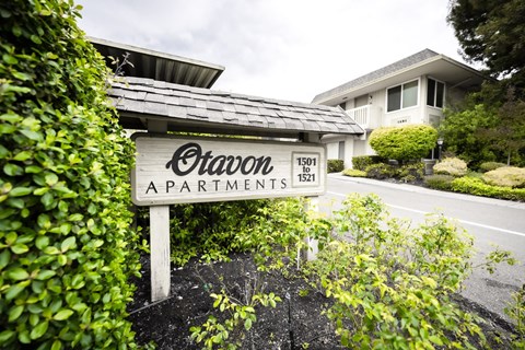 a monument sign in front of a building at OTAVON APARTMENTS, Novato, 94947