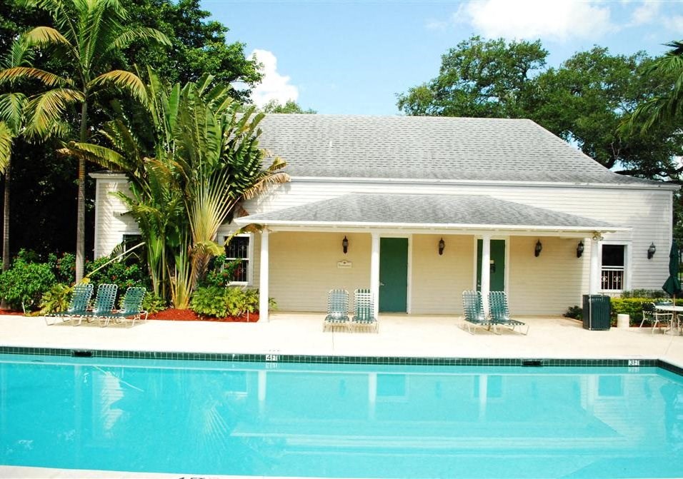 Pool with lounge chairs at Bay Winds, Florida