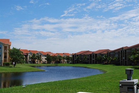 Renaissance community exterior with palm trees and lake views at Renaissance, West Palm Beach