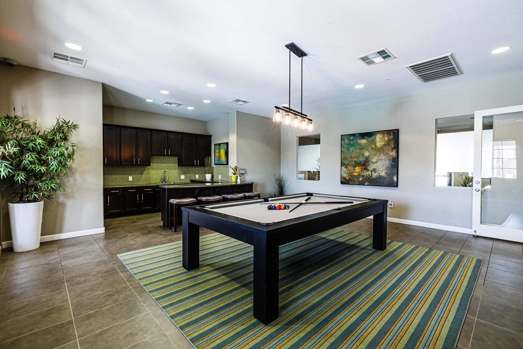 play a game of pool in our games room at EVERETT APARTMENT HOMES, Las Vegas, NV