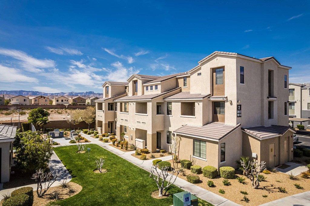 an aerial view of a row of houses with grass and a sidewalk at EVERETT APARTMENT HOMES, Nevada