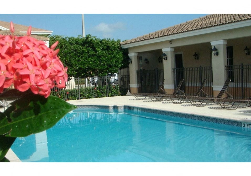 Pool with lounge chairs Bonita Pointe in Florida City Florida