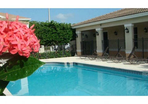 the pool is in front of the house