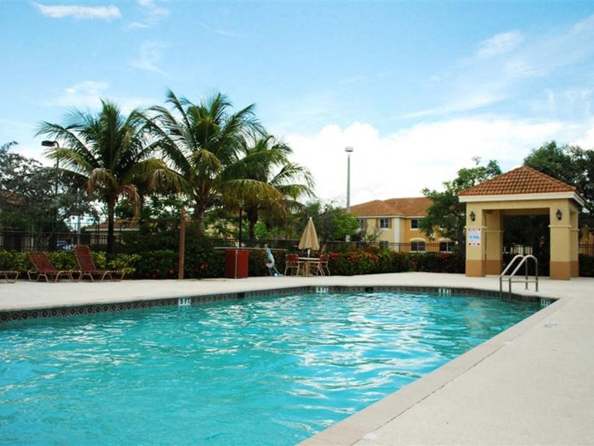 Pool with lounge chairs Captiva Club Miami Florida Apartments