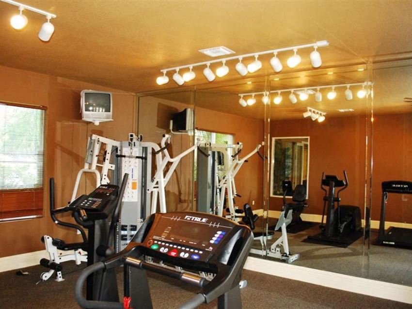 Gym with cardio and weight equipment Captiva Club Miami Florida Apartments