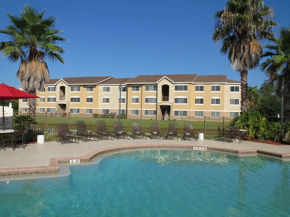 Swimming Pool with lounge chairs Swimming Pool with lounge chairs at Carolina Club Apartments, Daytona Beach, 32114