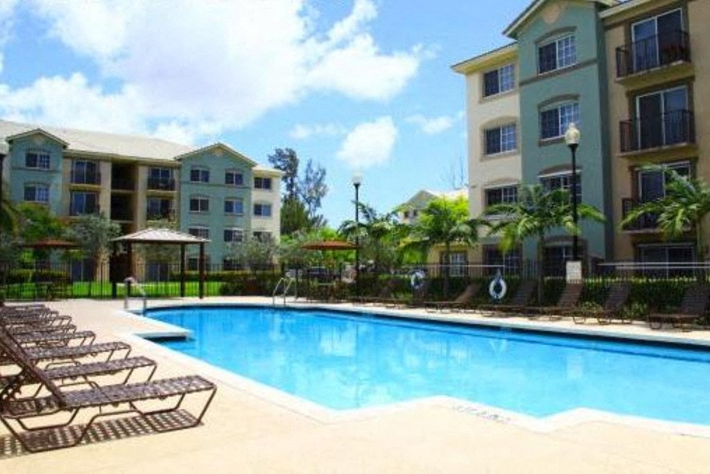 Pool with lounge chairs at Harbour Cove, Hallandale Beach, FL