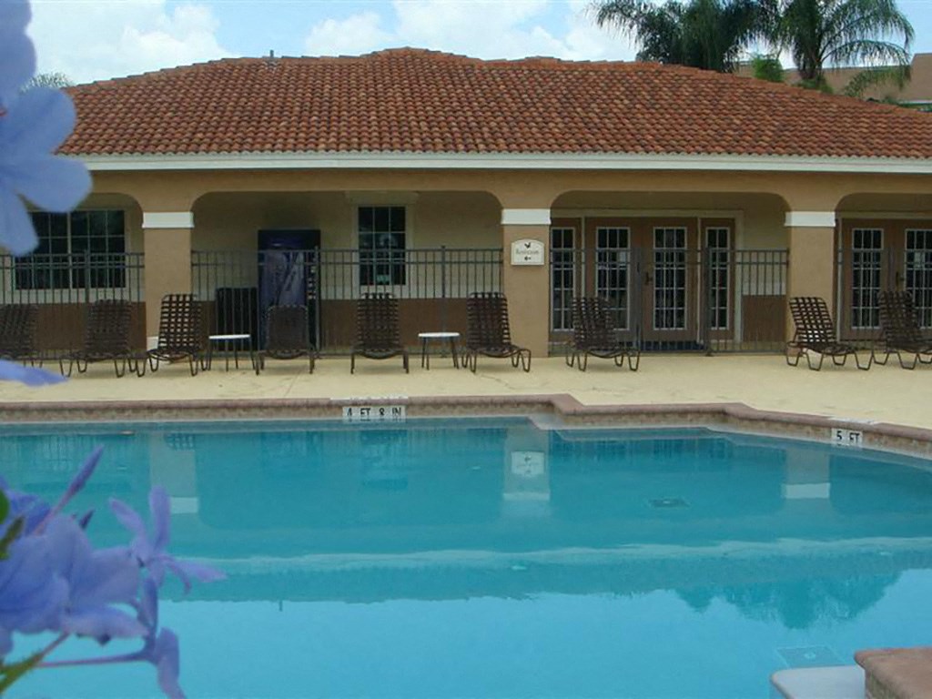 Pool and lounge chairs at Hawk's Landing Apartments, Florida