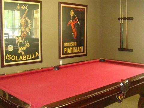 Pool table in center of room at Hawk's Landing Apartments, Fort Myers