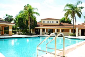 Pool with lounge chairs Hidden Cove Apartments in Miami Florida - Photo Gallery