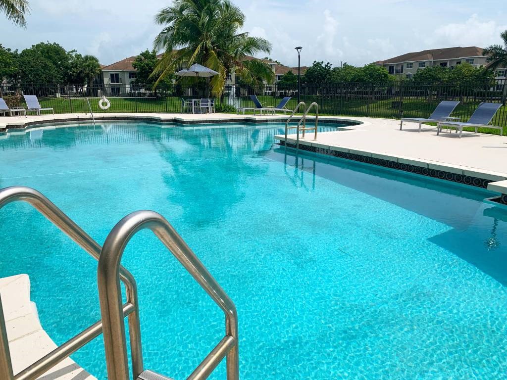 Tuscany Place resort style pool and lounge chairs at Tuscany Place Apartments, Homestead , FL 33032