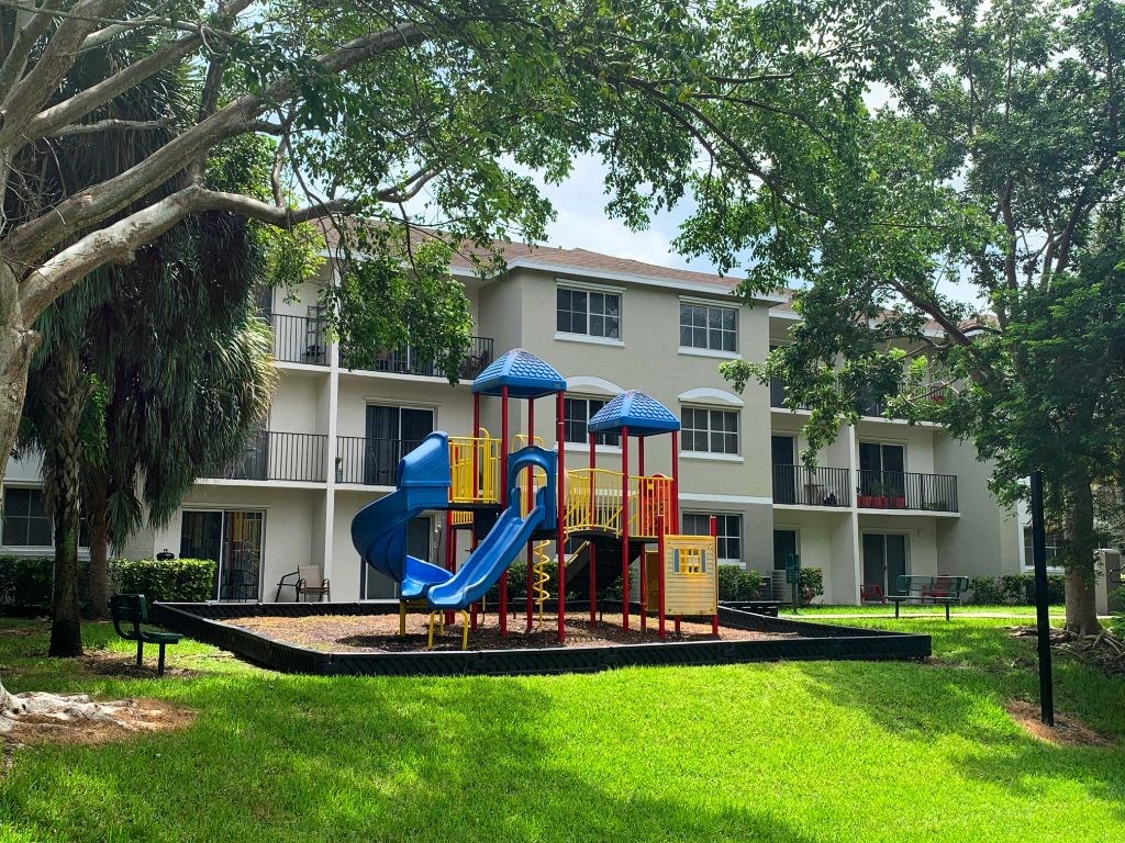Outdoor playground at Tuscany Place Apartments, Homestead , 33032