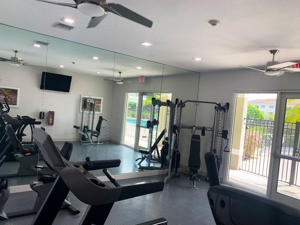 fitness center with cardio and weight equipmen at Tuscany Place Apartments, Homestead , 33032