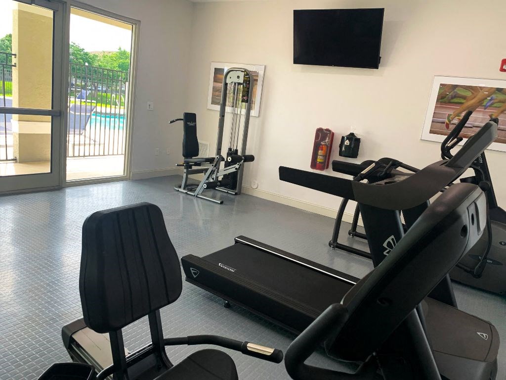 Tuscany Place fitness center with cardio and weight equipment at Tuscany Place Apartments, Homestead , Florida