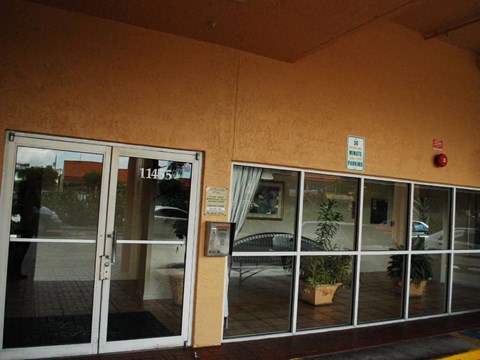 a building with large glass doors and a lobby