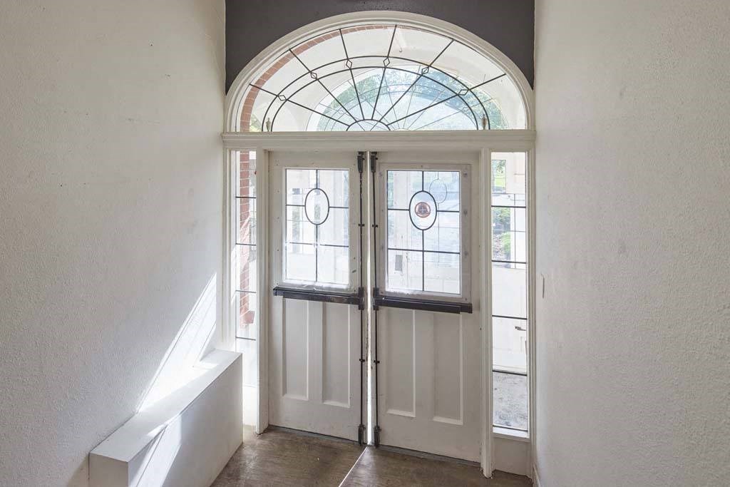 a large white door with a window above it at MILEPOST 5 Apartments, Oregon, 97213