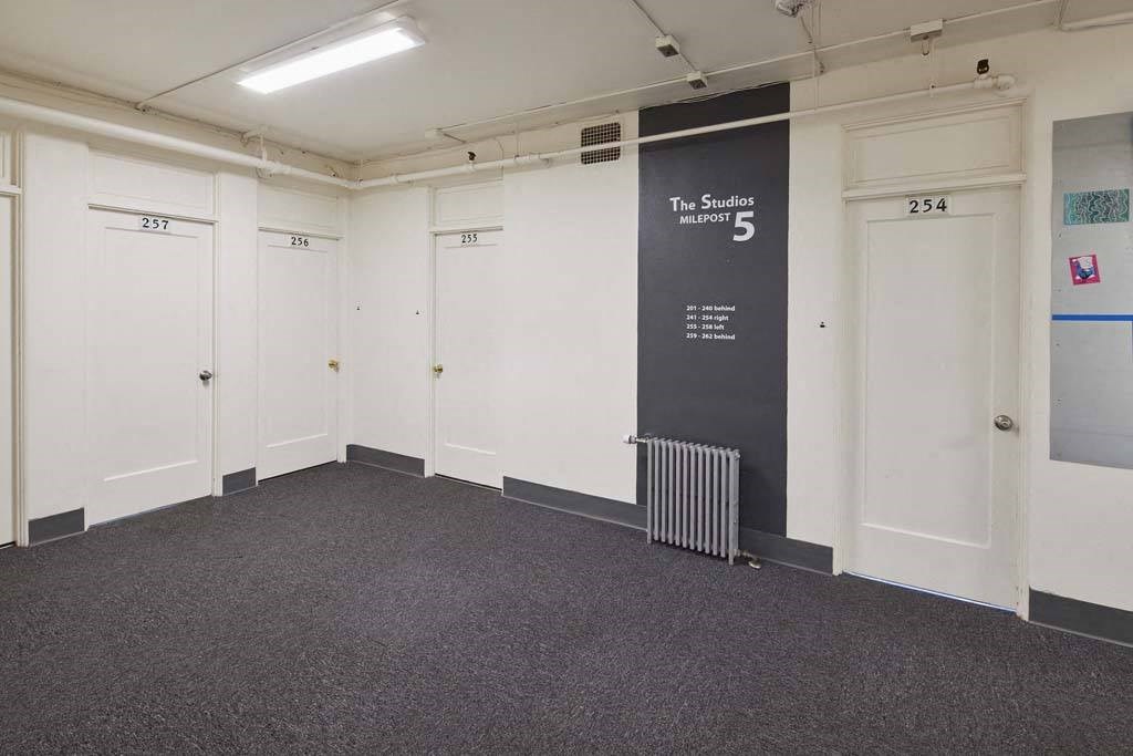a row of white doors in a room at MILEPOST 5 Apartments, PORTLAND