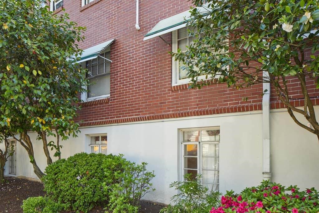 Building with two windows and a white facade at MILEPOST 5 Apartments, PORTLAND, 97213