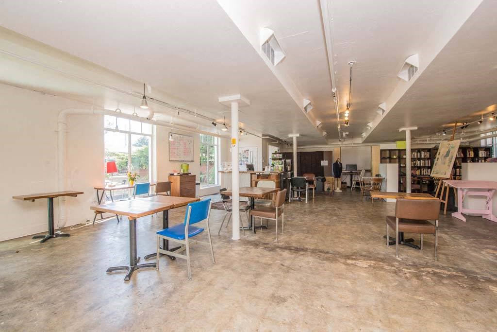 a large room with lots of tables and chairs at MILEPOST 5 Apartments, Oregon, 97213