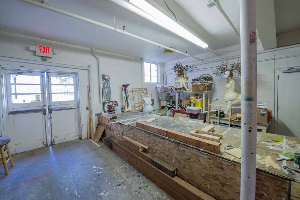 a room filled with lots of wooden furniture at MILEPOST 5 Apartments, PORTLAND Oregon