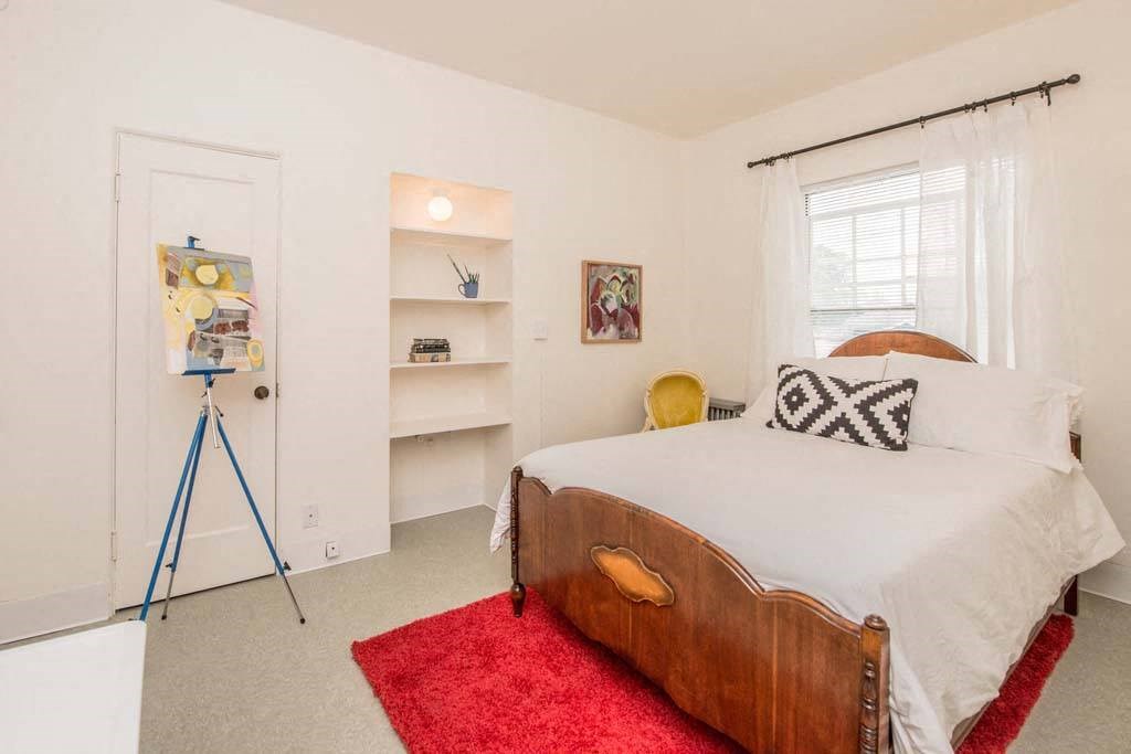 a bedroom with a bed and a window at MILEPOST 5 Apartments, PORTLAND, OR