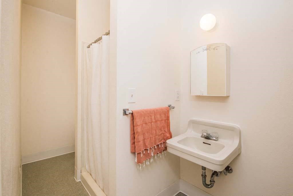 a bathroom with a sink and a shower at MILEPOST 5 Apartments, PORTLAND Oregon