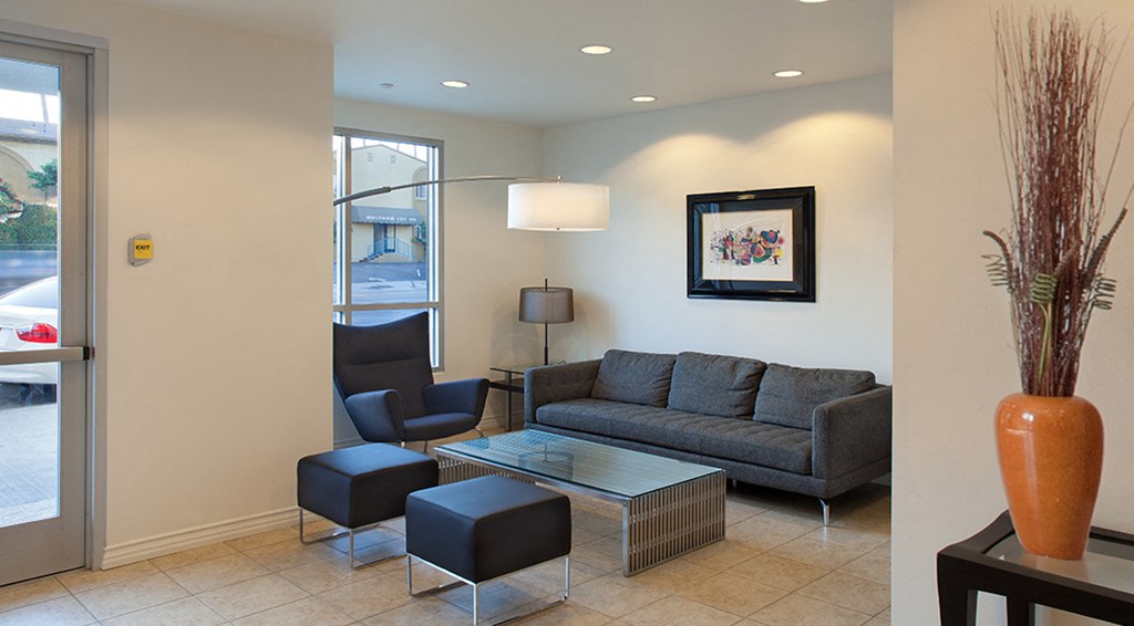 a living room with couches chairs and a coffee table