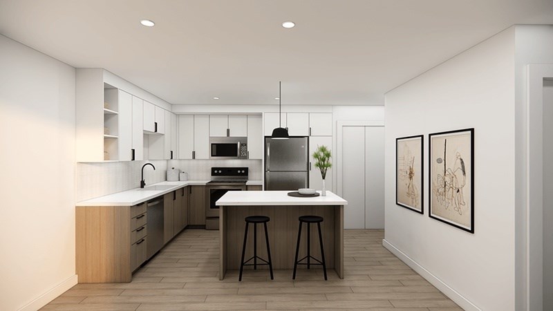 A modern kitchen with a center island and bar stools. at 38° NORTH, California