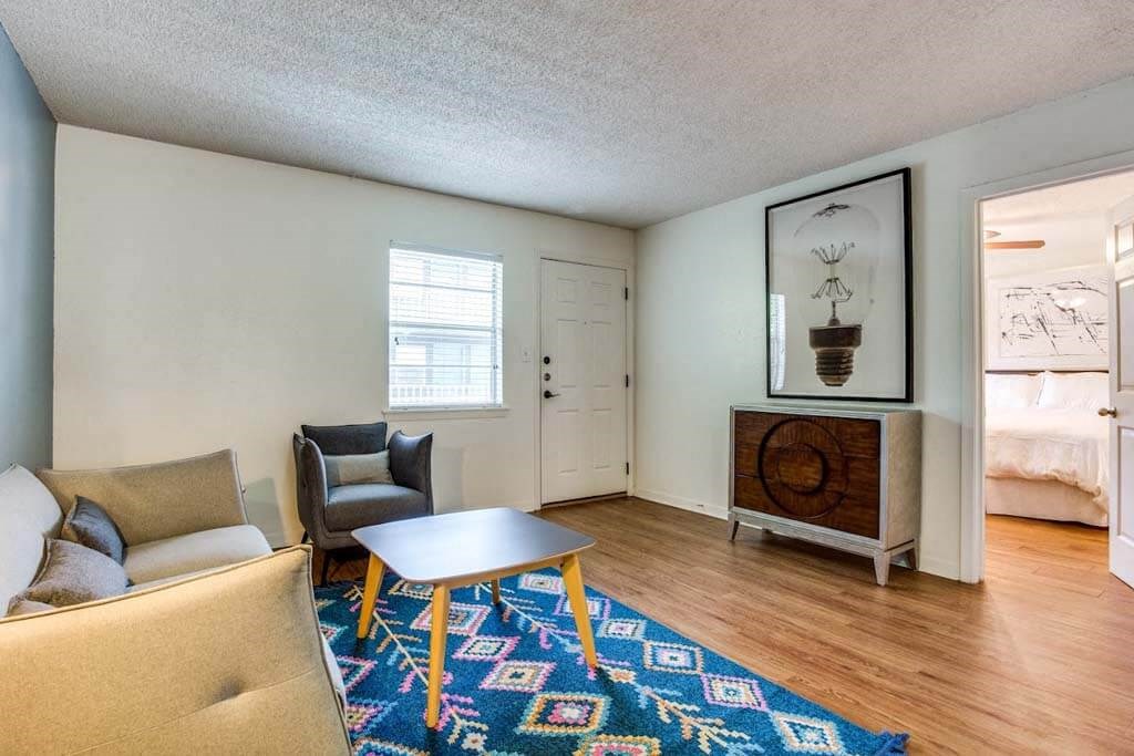 living room with a couch and a table at THE EASTWOOD, AUSTIN, TX 78705