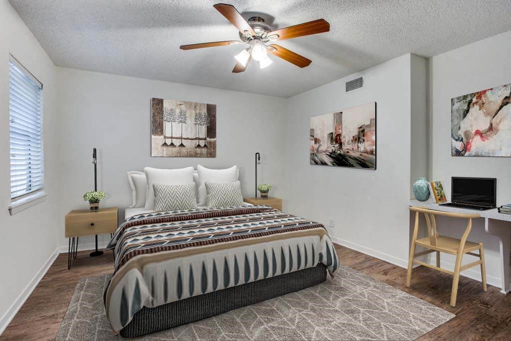 bedroom with a bed and a ceiling fan at THE EASTWOOD, AUSTIN